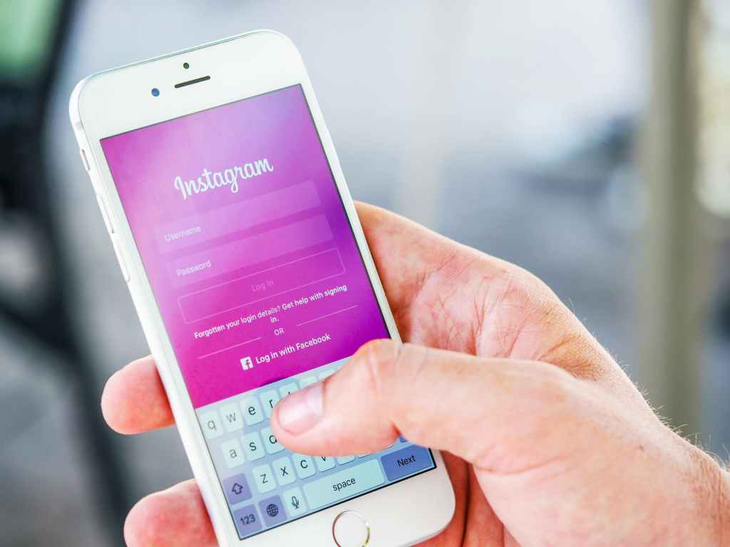 improve your social media presence: smartphone with instagram app pulled up on screen